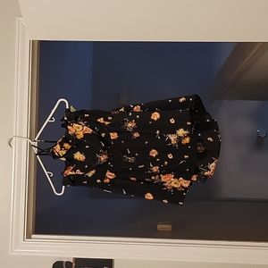 String strap blouse /  criss-cross in front . Black w pink flowers .